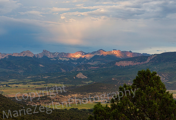 Lit Clouds and Light on Mountains at Sunset