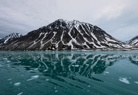 Mountain Reflections on Glacial Water