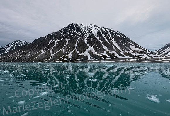 Mountain Reflections on Glacial Water
